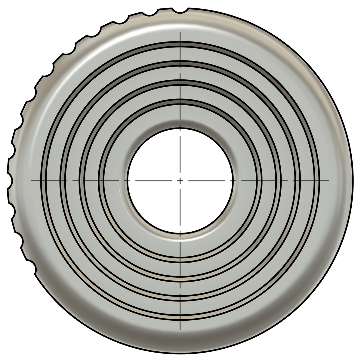 A circular metal coin-shaped object with a partially serrated or notched outer edge, concentric grooved lines, and a crosshair-style center marking.